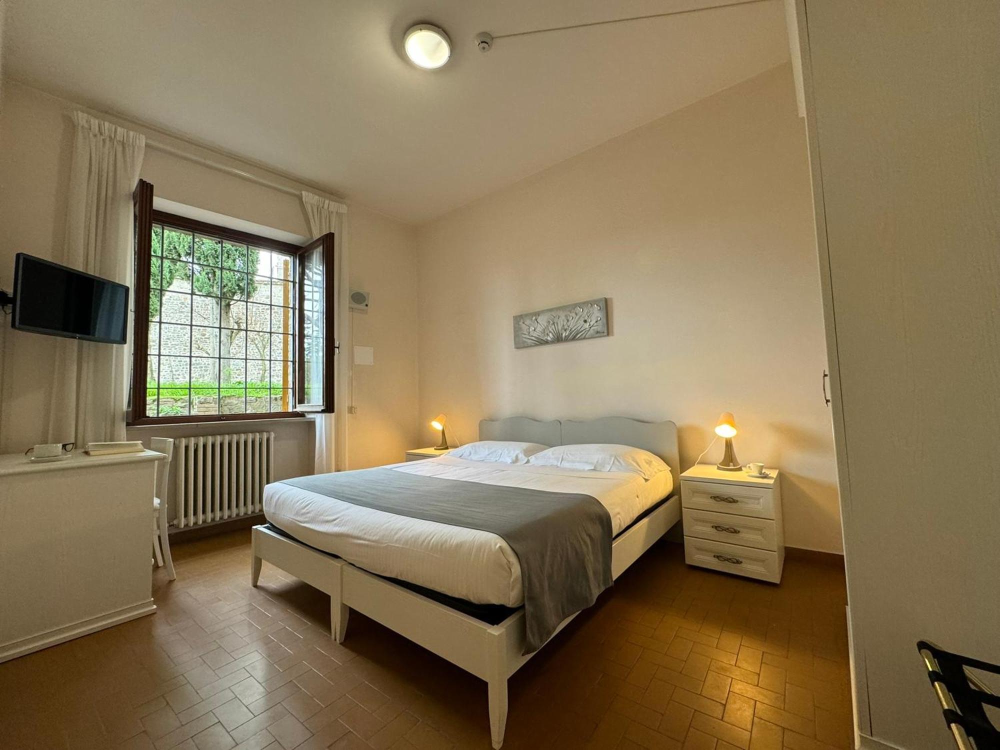 Отель Monastero Ss. Annunziata Тоди Экстерьер фото A room at the hotel