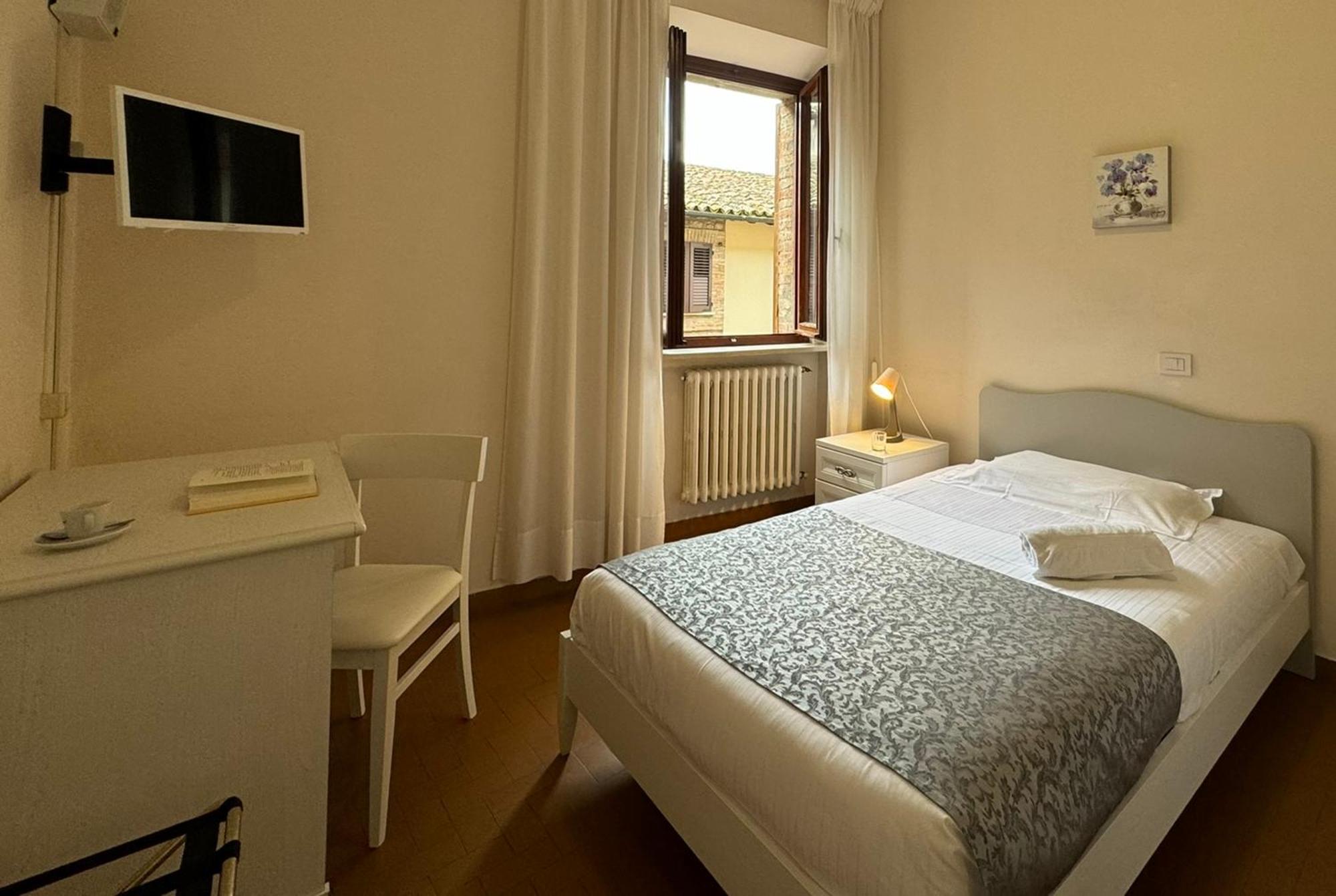 Отель Monastero Ss. Annunziata Тоди Экстерьер фото A room at the hotel