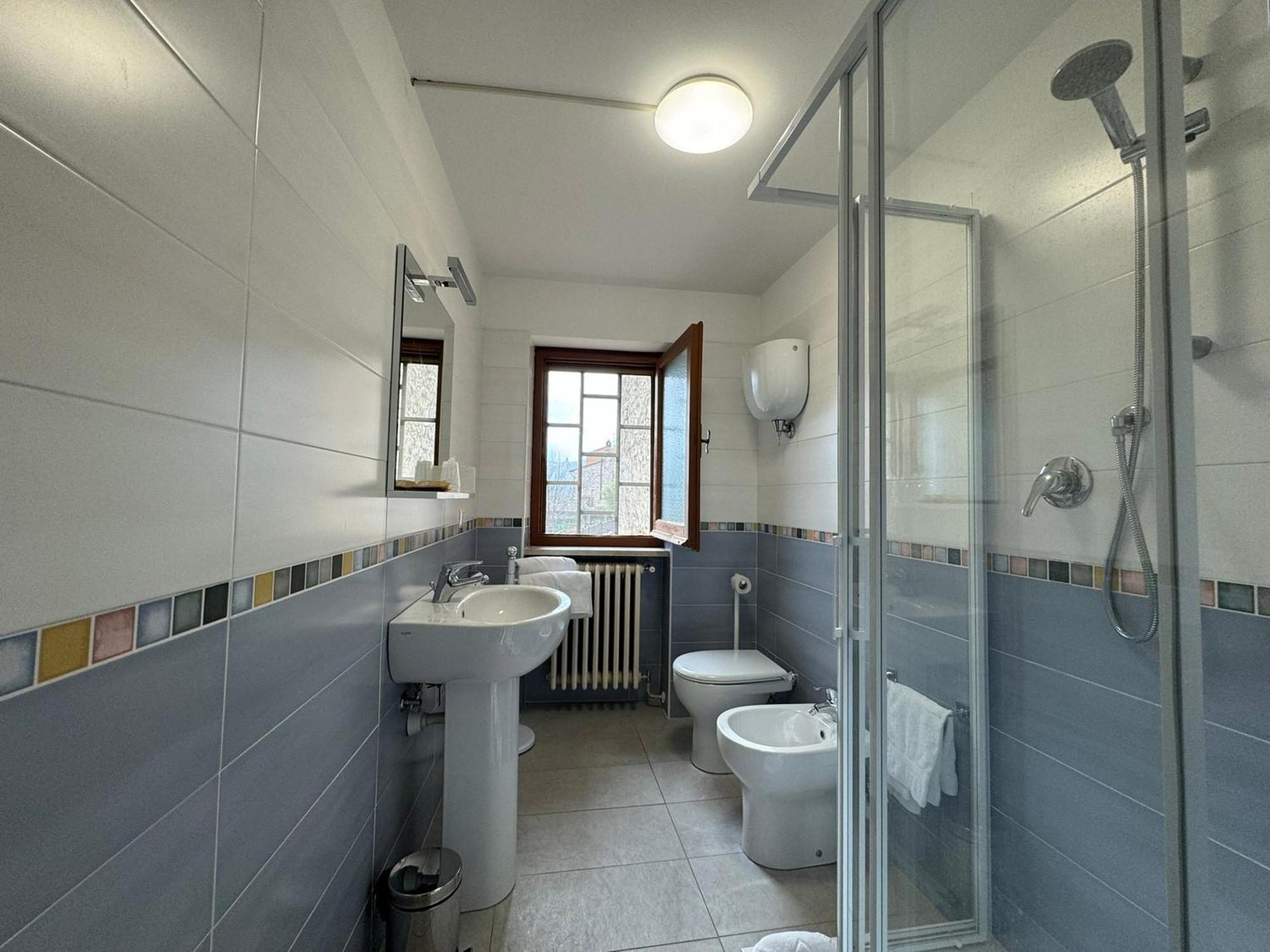 Отель Monastero Ss. Annunziata Тоди Экстерьер фото Bathroom with shower enclosure